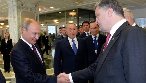 Путин назвал переговоры с Порошенко позитивными